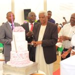 Prof Iraka Owange, the MRRH Board chair (‘in kanzu’) led the MRRH & MUST staff during the cake cutting ceremony. This was performed to thank God for rewarding the Hospital Director a gift of life.