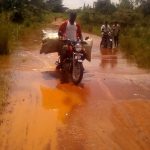 210930032256 A motorist wades through one of the affected roads. Parts of Northern Uganda has been witnessing flash floods since the beginning of the rainy season. Photo by Chris Woo