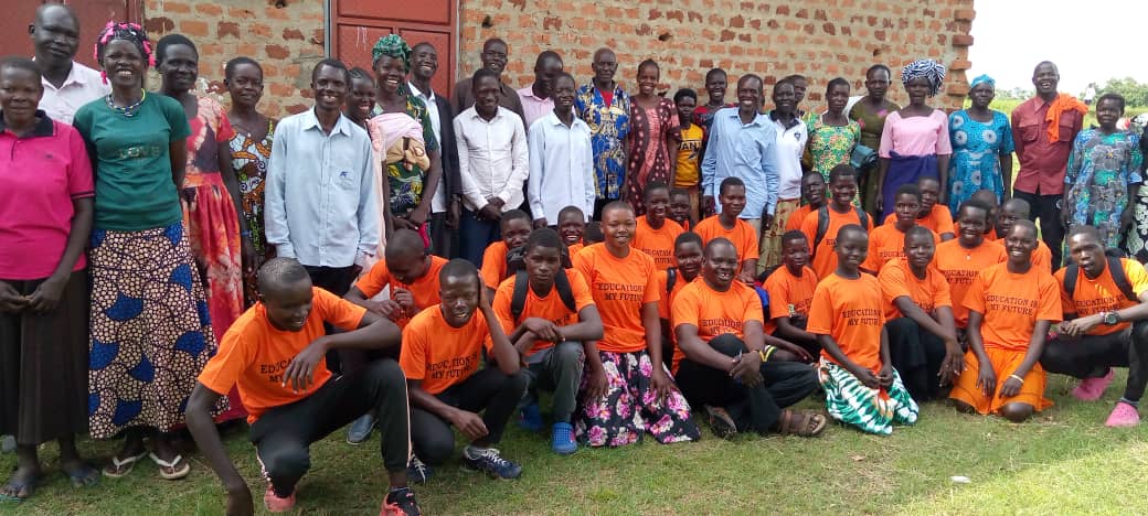 Parents and benefactor childrens pose for a group photo