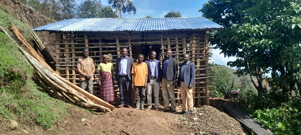 LOCAL LEADERS AND AICM OFFICIALS AT ONE OF THE DONATED HOUSE LOCAL LEADERS AND AICM OFFICIALS AT ONE OF THE DONATED HOUSE