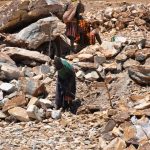 Karimojong women breaking marble limestones in Kosiroi in Tapac sub county in Moroto district (photo by Steven Ariong)