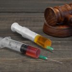 Judges,Gavel,And,Two,Medical,Injection,Syringes,With,Red,And