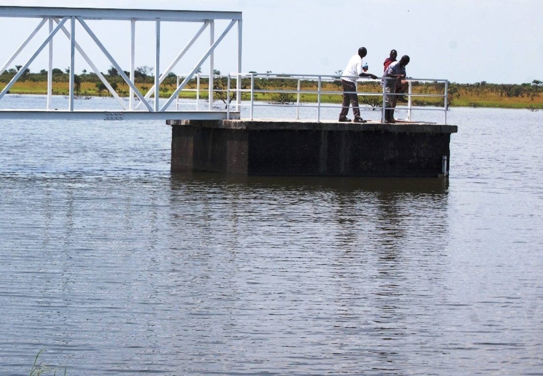 The enginneers from the ministry of water and environment standing on the contral chmaber of Arecek water dam in Napak district (photo by Steven Ariong)