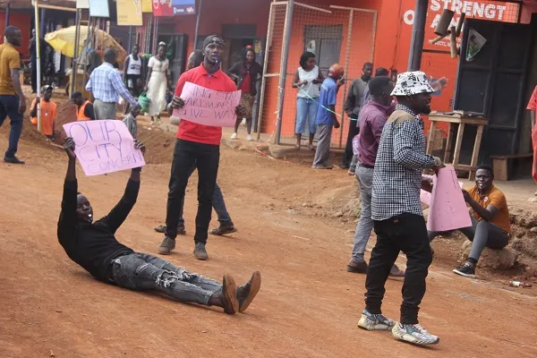 The youth who camped at the King Star building in Hoima city demanding that the owner paves way for construction of the road Photo by Peter Atugonza.