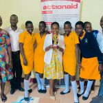 Toroma peas students after winning take a photo with a secretery for eduction in katakwi DLG
