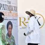 President Museveni signs on a dummy booklet as he launches Hon Rebecca Kadaga's book at Kololo on Wednesday as Hon Kadaga look on. PPU Photo (2)
