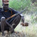 Armed Karimojong pastoralist grazing his animals along Karamoja, Turkana border in Moroto district (photo by Steven Ariong)