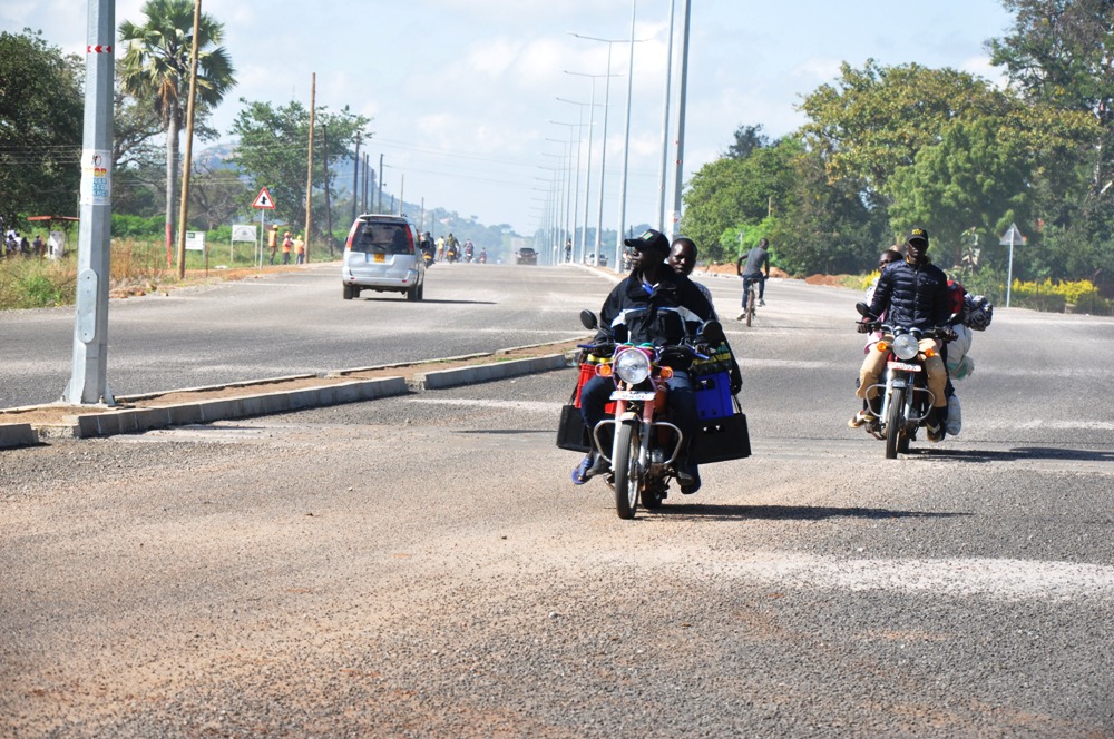 Bodabodas using the newly constructed Moroto, Soroti road with good looking street lights in Katakwi town (photo by Steven Ariong)