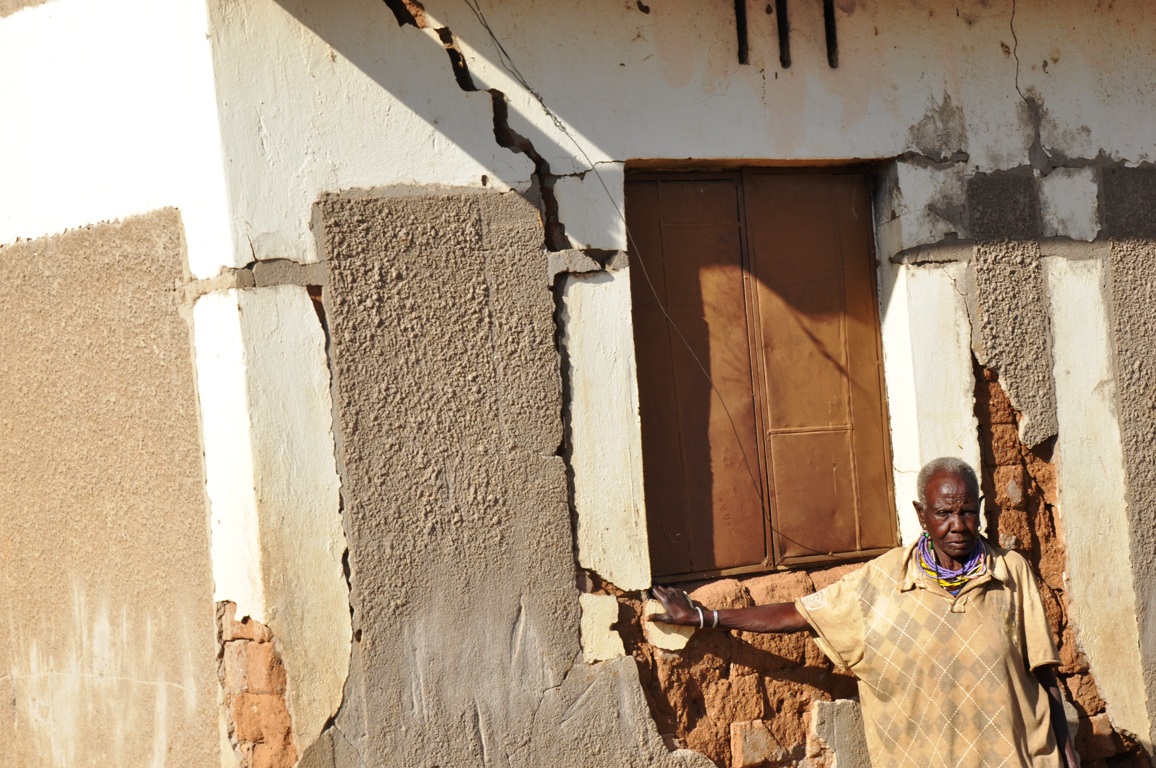 Sabinah Lochoro standing at house alocated to her which is at the verge of collapsing in Loputiput village in Nadunget sub county in Moroto district on Saterday (photo by Steven Ariong)