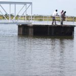 The enginneers from the ministry of water and environment standing on the contral chmaber of Arecek water dam in Napak district (photo by Steven Ariong) (1)