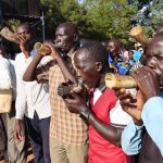 Believers playing musical instruments during crusade at Mayors Garden