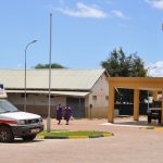 Nurse walk by the compound of Moroto regional referal hospital which was upflited last year (photo by Steven Ariong)
