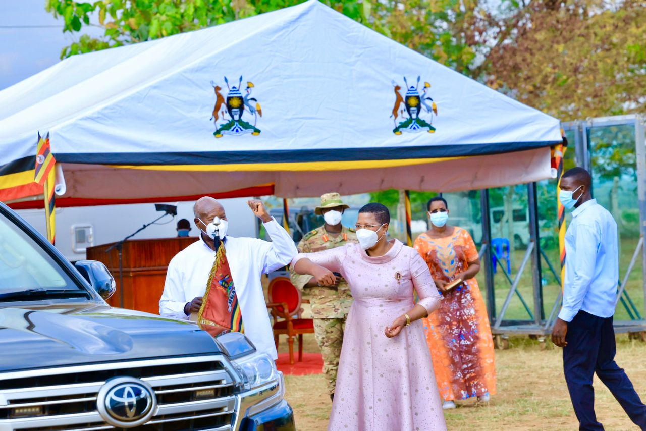 Among Museveni Fist Bump