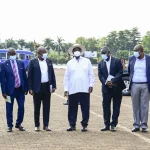 President Museveni poses for a photo with members of the Patriotic club during the 13th Tarehe Sita thanksgiving ceremony at Kololo on Thursday. PPU Phototar8 scaled
