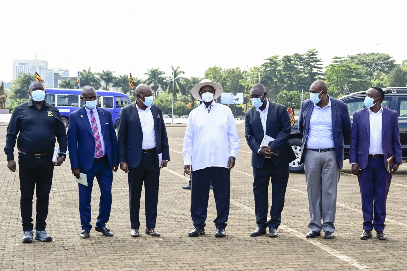 President Museveni poses for a photo with members of the Patriotic club during the 13th Tarehe Sita thanksgiving ceremony at Kololo on Thursday. PPU Phototar8 scaled