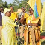 Rose Namayanja Nsereko hands over the NRM flag to Janet Adongo Elau Dokolo