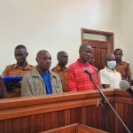 The suspected murderers of Joan Kagezi standing in the Court Dock.