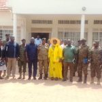 Amuru Deputy RDC Proscovia Acham in yellow Attire and other security committee in a group photo on Friday.