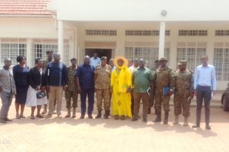 Amuru Deputy RDC Proscovia Acham in yellow Attire and other security committee in a group photo on Friday.