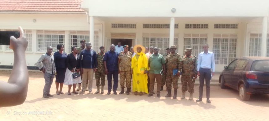 Amuru Deputy RDC Proscovia Acham in yellow Attire and other security committee in a group photo on Friday.