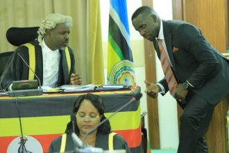 Opposition Leader Slams Government for Empty Promises on Corruption and Economic Challenges - Ssenyonyi confers with Deputy Speaker Tayebwa during the sitting of the House.