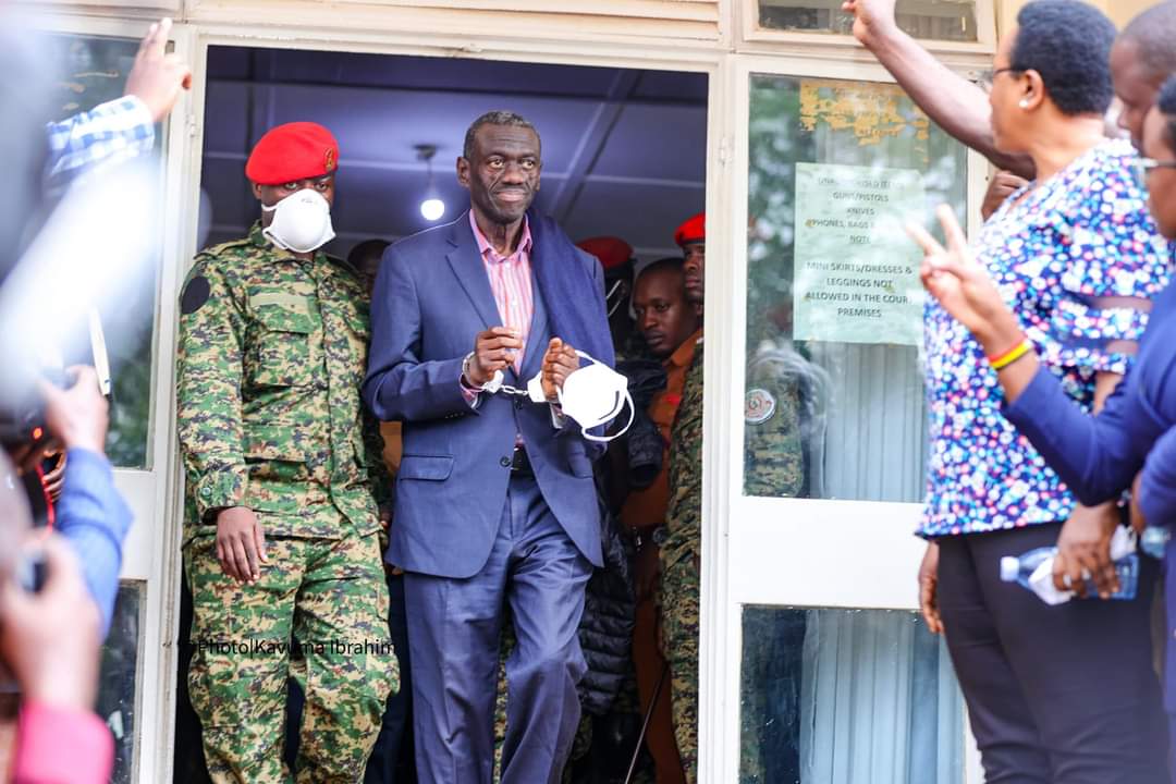 Besigye and Lutale stand accused of a few mysterious activities. These include possession of a pistol (at Riverside Apartments in Nairobi, Kenya, no less) and conspiring in Greece and Switzerland with the intent to undermine Uganda’s security. Now, let’s be clear: not many of us wake up in Kampala and think, “Hmm, today I’ll plot to destabilize the government from a coffee shop in Athens.” But here we are, with two men being accused of some rather internationally ambitious plots.