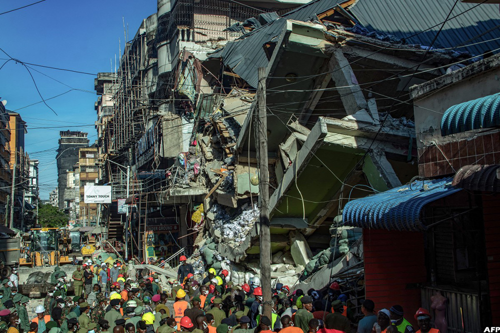 A four-story building in Dar es Salaam's Kariakoo market collapsed, leaving five dead, dozens injured, and many still trapped as rescue efforts continue.