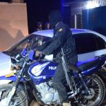 Security officer on night patrol in Greater Masaka Region.