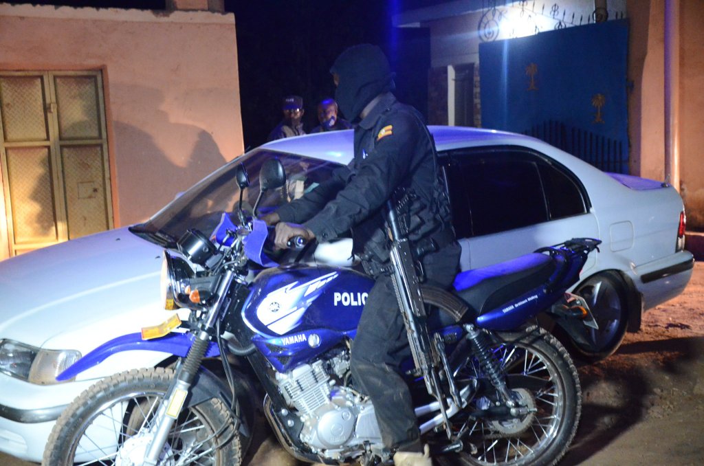 Security officer on night patrol in Greater Masaka Region.