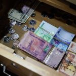The Uganda shilling experienced a volatile session on Tuesday, weakening due to strong demand from the energy sector before partially recovering, with money markets showing tight liquidity.